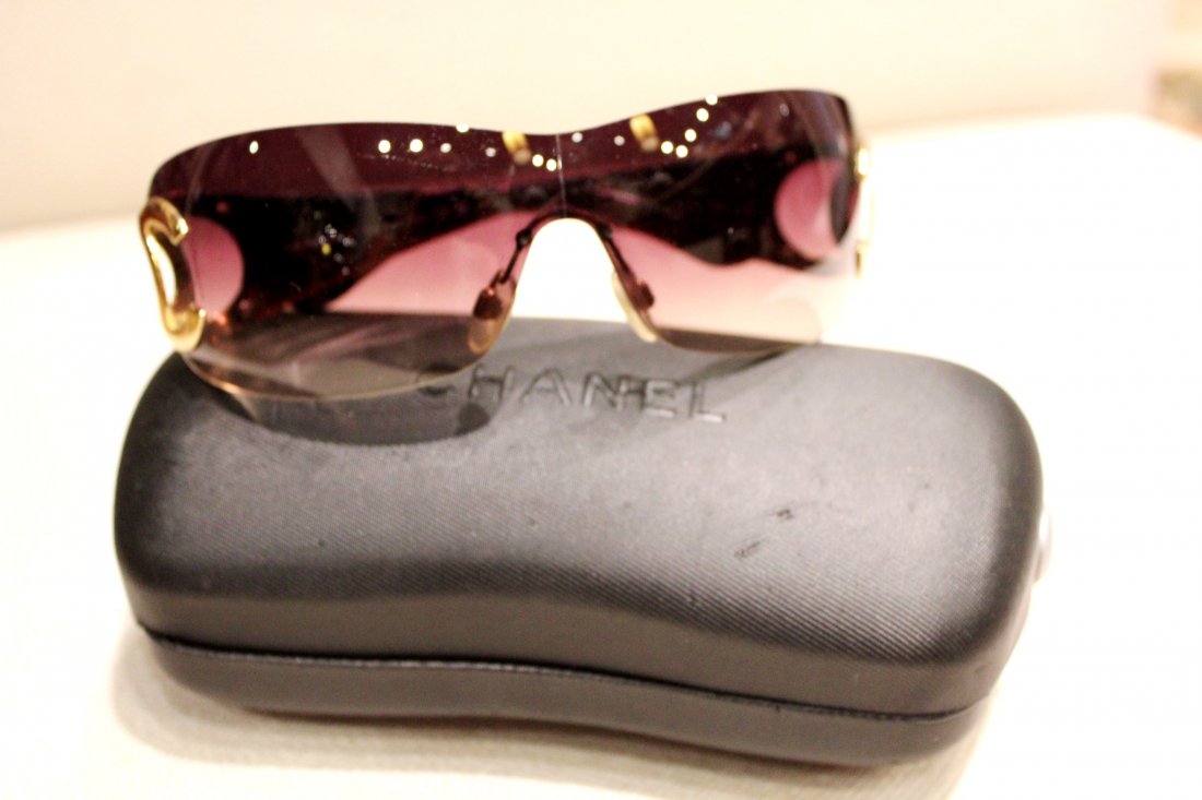 Women's Chanel Sunglasses with Case: Women's Chanel Sunglasses. Brown frame and brown lens. Gold Chanel Symbol. 100% Authentic Made in Italy. Serial #: 4125 c.125/13 120. Includes Hard Chanel Case and Chanel Protective Sleeve.