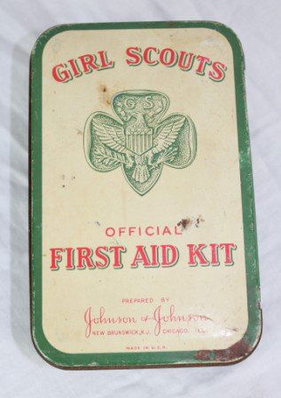 Vintage Girl Scout First Aid Kit with Badges: Vintage Girl Scout First Aid Kit includes lot of badges, 2 Scarfs and Pin. Tin reads Girl Scouts with the logo official First Aid Kit prepared by Johnson and Johnson made in USA. It has a metal belt l
