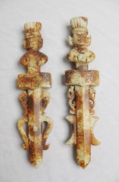 Han Dynasty Ceremonial Jade Daggers: Chinese Calcified Jade Ceremonial Dagger. Han Dynasty style Before 100 AD. 11 inches long by 2 1/2 inches wide by 1 inch thick.
