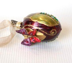 Jay Strongwater Crystal Ornament- Ball Shape With Butte: Jay Strongwater Ball Ornament With Butterflies with cherries. Colors include: green, blue, gold, and maroon. Measuring approximately 5 x 3.