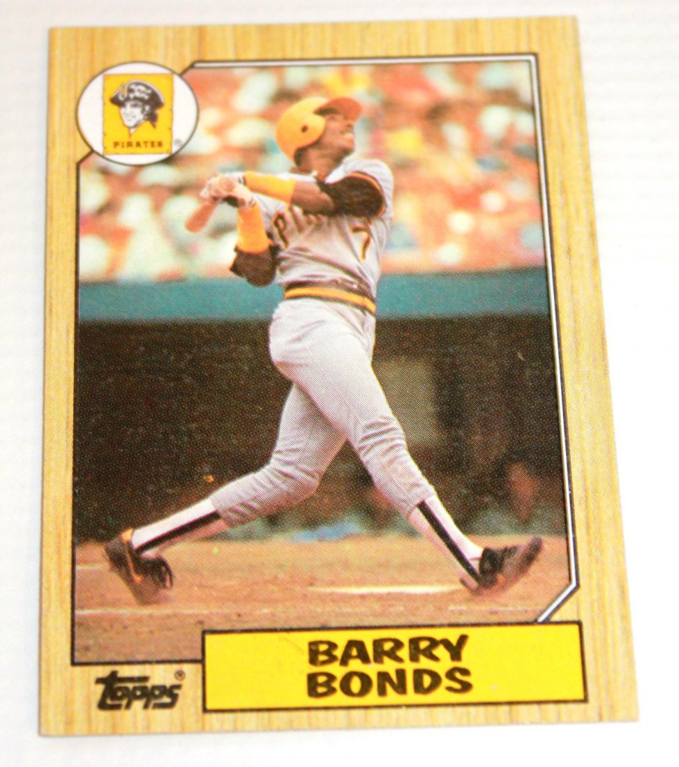 1987 Barry Bonds Topps Baseball #320 Rookie Card: 1987 Topps Baseball Barry Bonds #320 Rookie Card. Ungraded. Comes with protective sleeve.