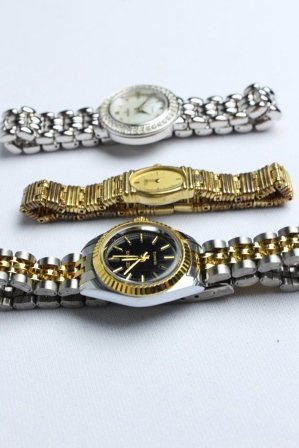 Lot of Watches, Seiko, Geneva, Peugeot: Vintage Gold and Black-faced Geneva Watch, Seiko Watch, Silver Peugeot Watch with diamond-like border around mother of pearl face.