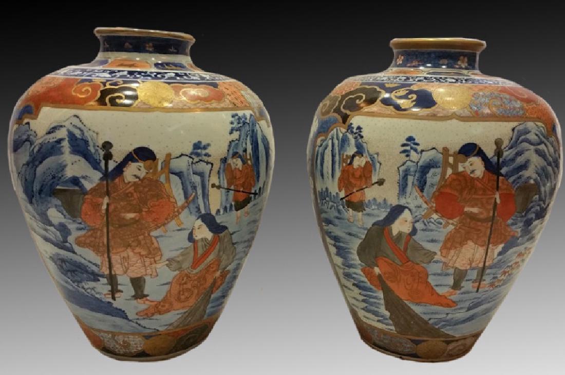 JAPANESE RARE MEIJI VASE PAIR: Pair of large and rare Meiji era painted porcelain vases with painted design of Buddhist lohan and people in landscape on reverse with beautiful gilt annd geometric designs. Unmarked. 16" tall 42" aro