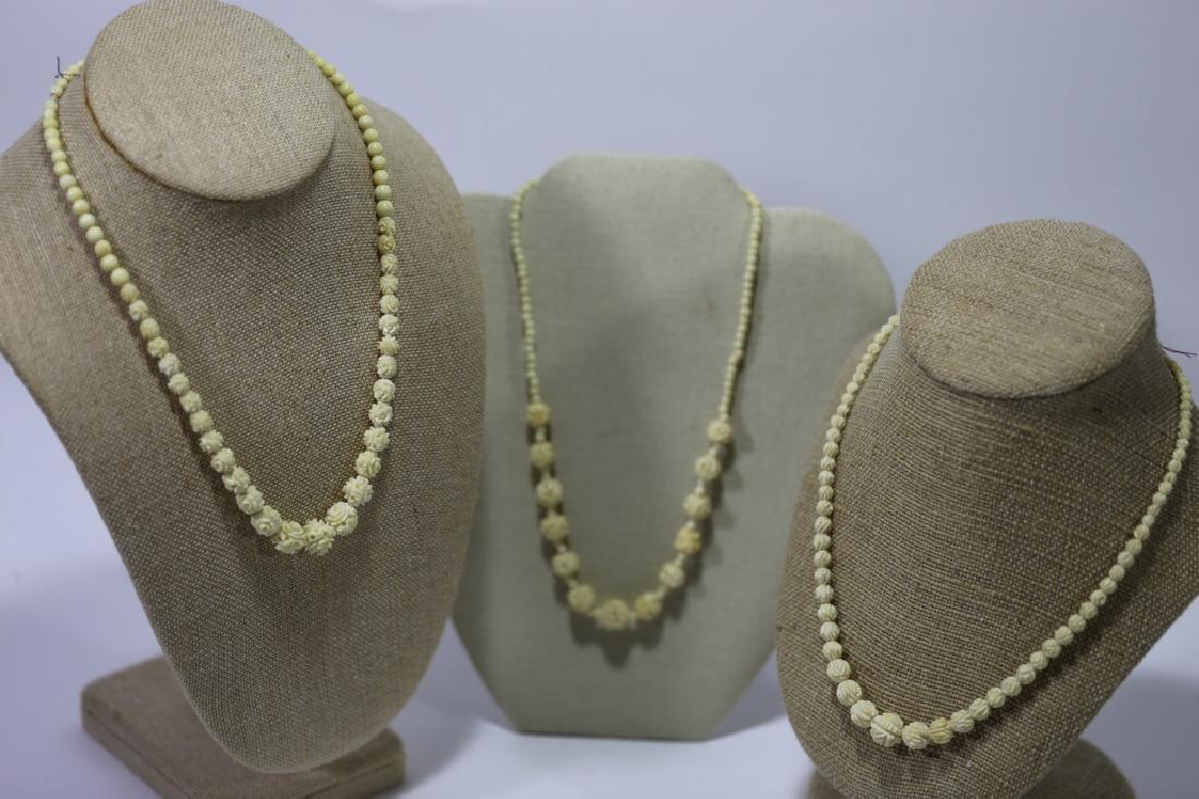 CHINESE ANTIQUE HAND CARVED NECKLACE GROUPING: CHINESE ANTIQUE HAND CARVED NECKLACE GROUPING