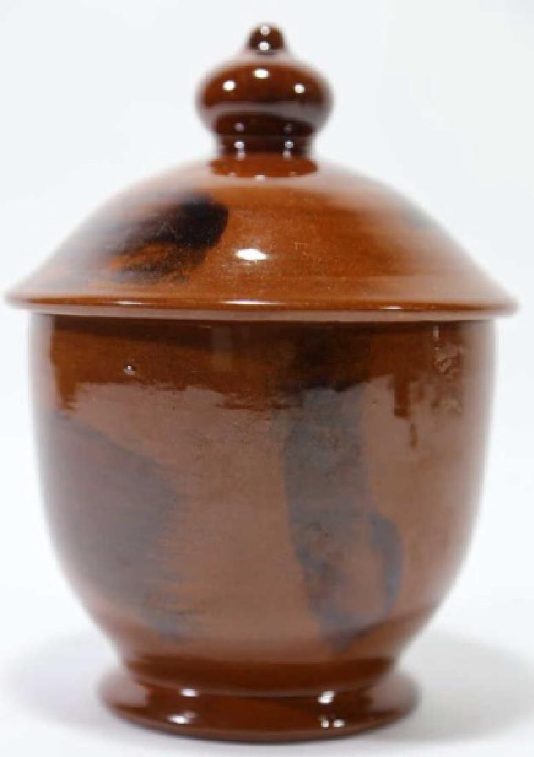 LESTER BREINIGER SIGNED LIDDED REDWARE POTTERY: SIGNED JUNE 26 1984 6.5 X 5.5" The Breiningers started their own pottery business, eventually employing six potters to craft pieces in the traditional Pennsylvania style. They used traditional colors