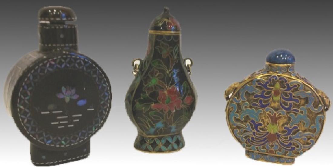 CHINESE SNUFF BOTTLE GROUPING: Lot of 3 Chinese snuff bottles, 2 cloisonné and 1 papier Mache with mother of pearl inlay. Tallest 2.5"