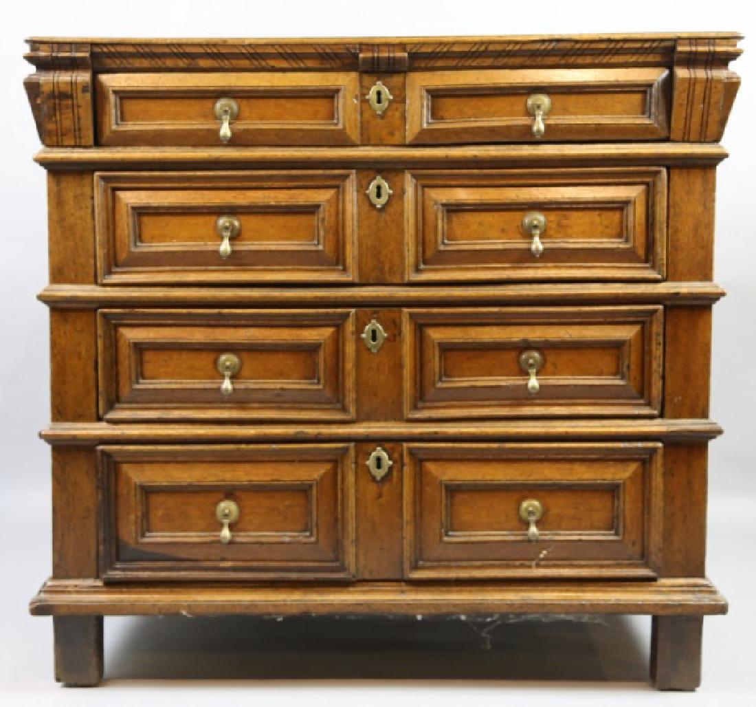 17TH C. JACOBEAN FOUR-DRAWER CHEST: 35" X 38" X 22"; C. 1680 JACOBEAN FOUR-DRAWER CHEST WITH DIAGONAL CUT CORNICE; MOLDED AND BLOCKED ON PLINTHS FLANKING FOUR GRADUATED RAISED PANEL DRAWERS WITH PENDANT BRASS PULLS; THE DRAWERS ARE SEPA