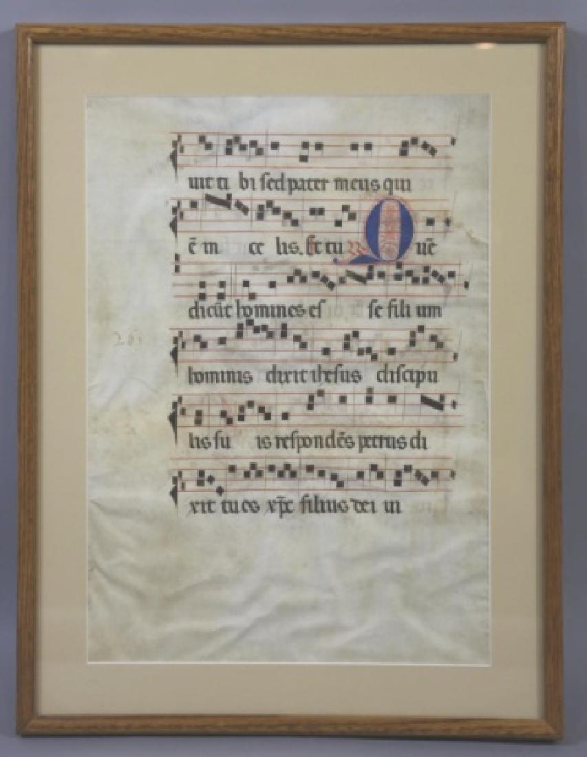 ANTIQUE MUSICAL SHEET SCORE (LATIN) ON VELLUM: ANTIQUE MUSICAL SHEET SCORE ON VELLUM 25 X 19" SHADOW DOUBLE SIDED FRAME ; FOLIO VELLUM PAGE FROM AN ANTEPHENORIUM WITH LATIN PLAINSONG TEXT; ILLUMINATED INITIAL LETTER