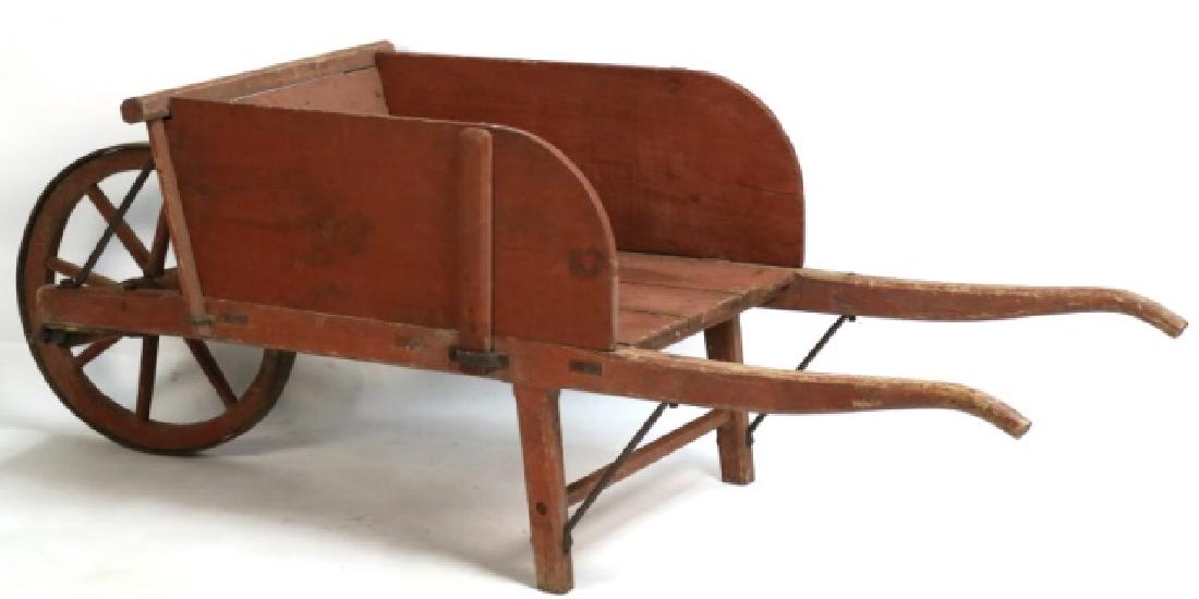 PENNSYLVANIA AMISH ANTIQUE RED PAINT WHEELBARROW: PENNSYLVANIA AMISH ANTIQUE RED PAINT WHEELBARROW WITH ORIGINAL IRON WORK MOUNTS 26 X 78 X 28''