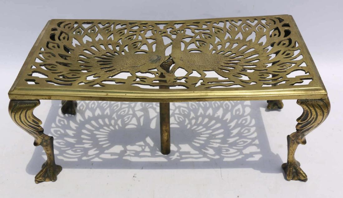 ENGLISH ANTIQUE BRASS PEACOCK MOTIF TRIVETTE: ENGLISH ANTIQUE BRASS PEACOCK MOTIF TRIVETTE 8 X 17 X 19"