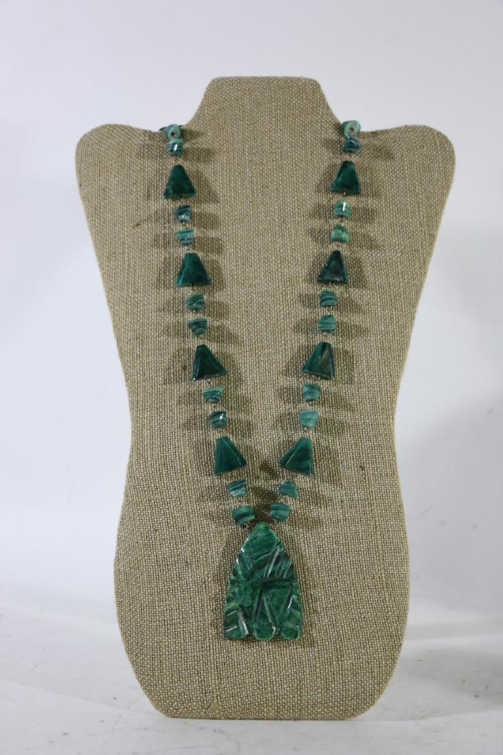 MALACHITE NECKLACE: MALACHITE NECKLACE APPROXIMATELY 30" IN LENGTH AND THE PENDANT IS 2.5" LONG X 1.5" WIDE