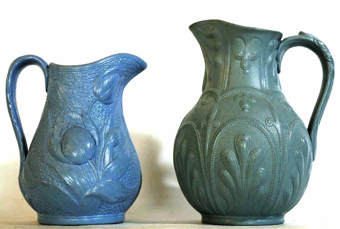 ENGLISH ANTIQUE MOLDED SALTGLAZE PITCHER PAIRING: TWO ANTIQUE PITCHERS, TALLEST ONE MEASURES 9 INCHES, BLUE HAS FLORAL DESIGN