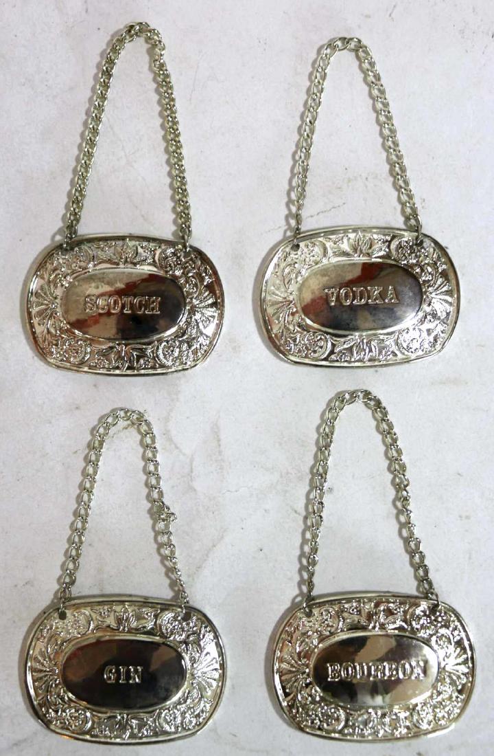 ENGLISH SILVER DECANTER LIQUOR LABEL GROUPING: ENGLISH SILVER DECANTER LIQUOR LABEL GROUPING OF FOUR