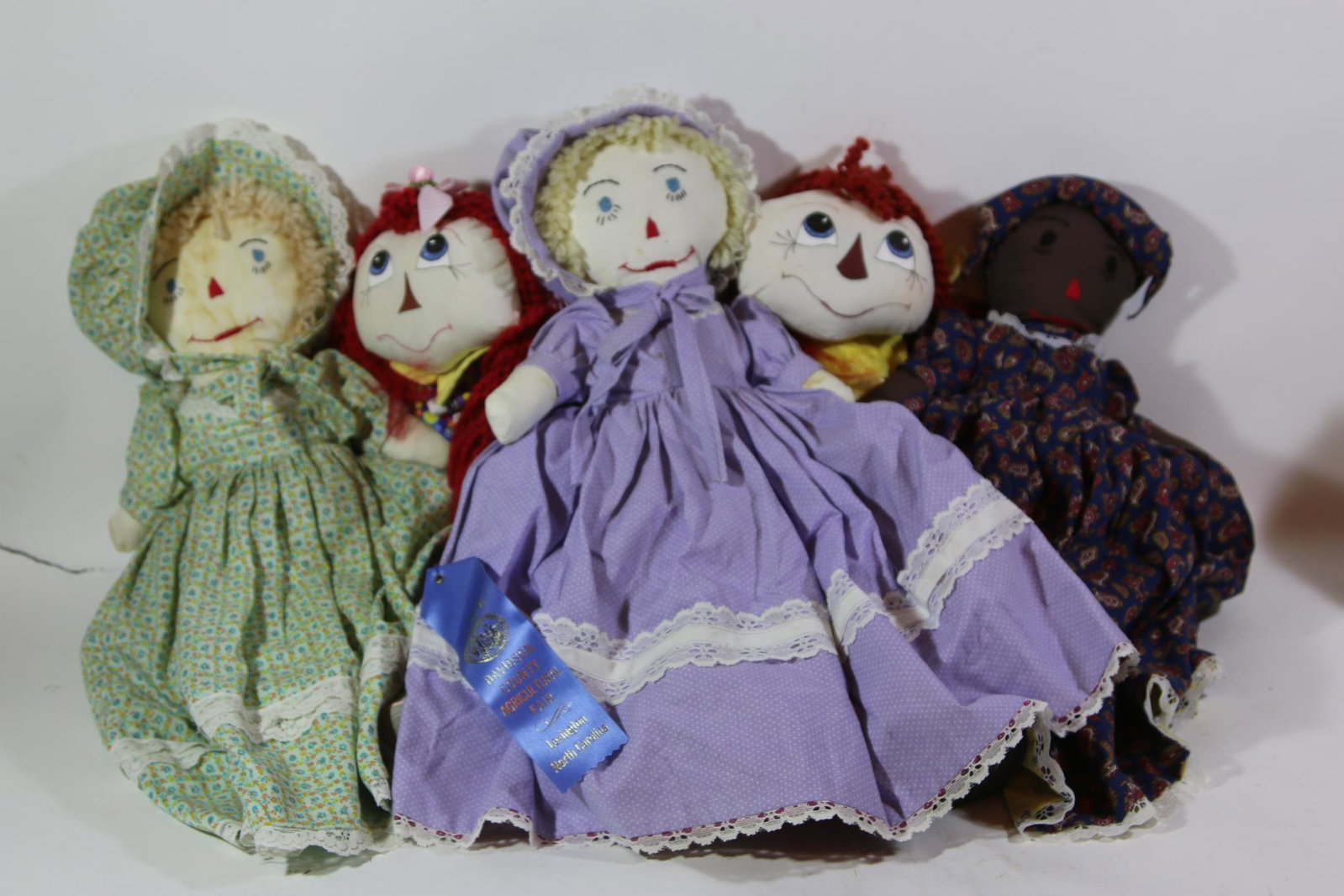 AWARD WINNING HANDMADE RAG DOLL GROUPING: HANDMADE RAG DOLL GROUPING, DAVIDSON COUNTY AGRICULTURAL FAIR FIRST PLACE BLUE RIBBON WINNER