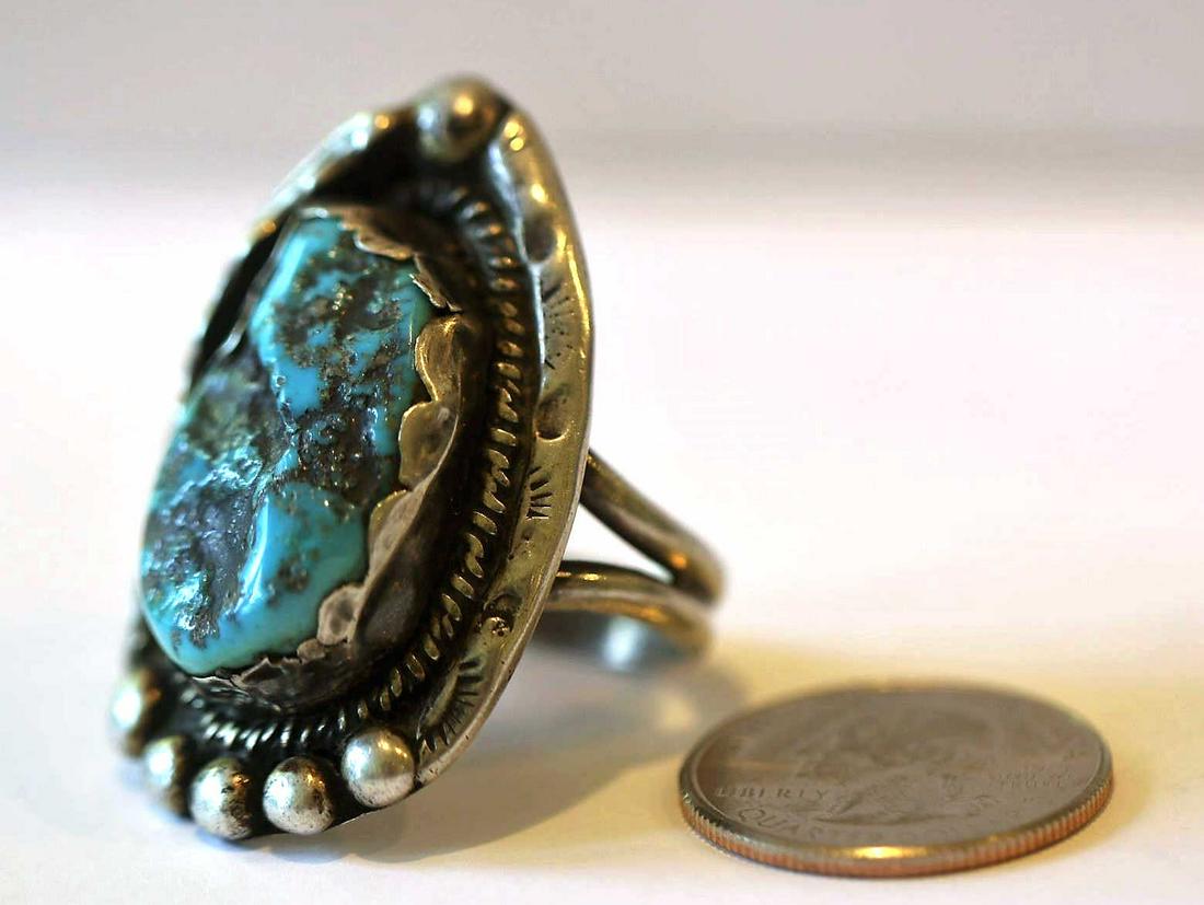 STERLING SILVER NATURAL TURQUOISE RING: NATIVE AMERICAN STERLING SILVER NATURAL TURQUOISE RING STAMPED, nearly 2" x 1 1/4", 28 g Condition Report GOOD