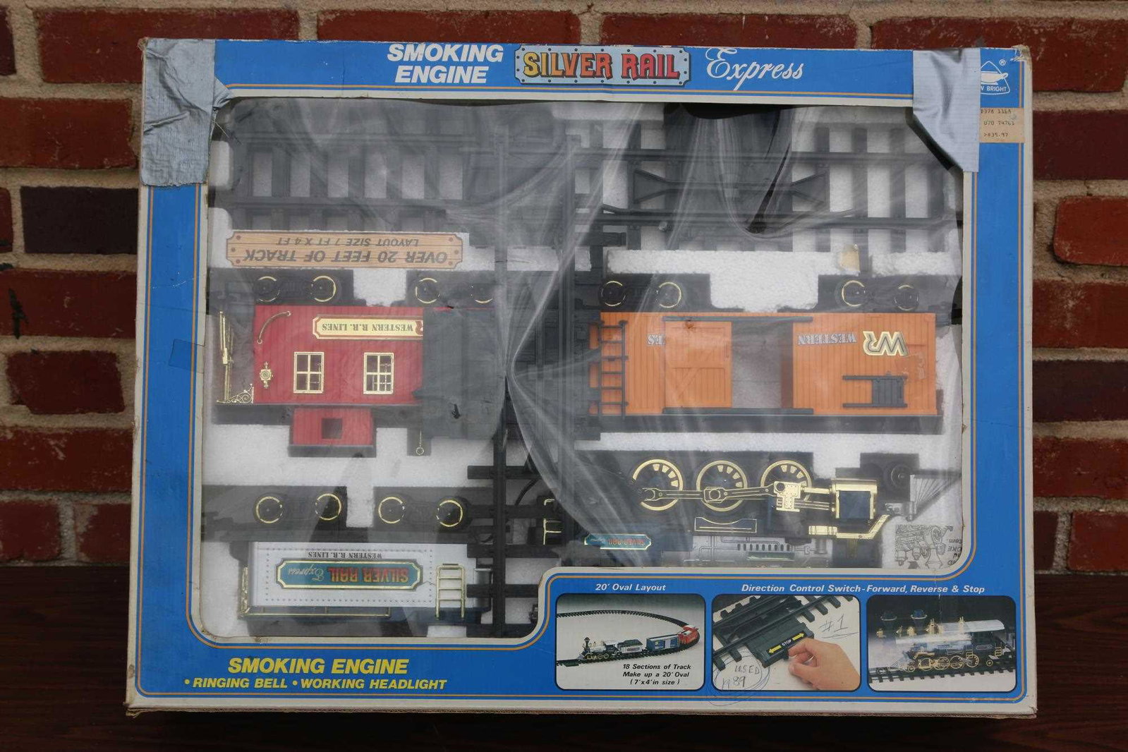 SILVER RAIL EXPRESS WITH SMOKING ENGINE & BELL: SMOKING ENGINE, RINGING BELL, AND WORKING HEADLIGHT "SILVER RAIL EXPRESS" TRAIN Condition GOOD