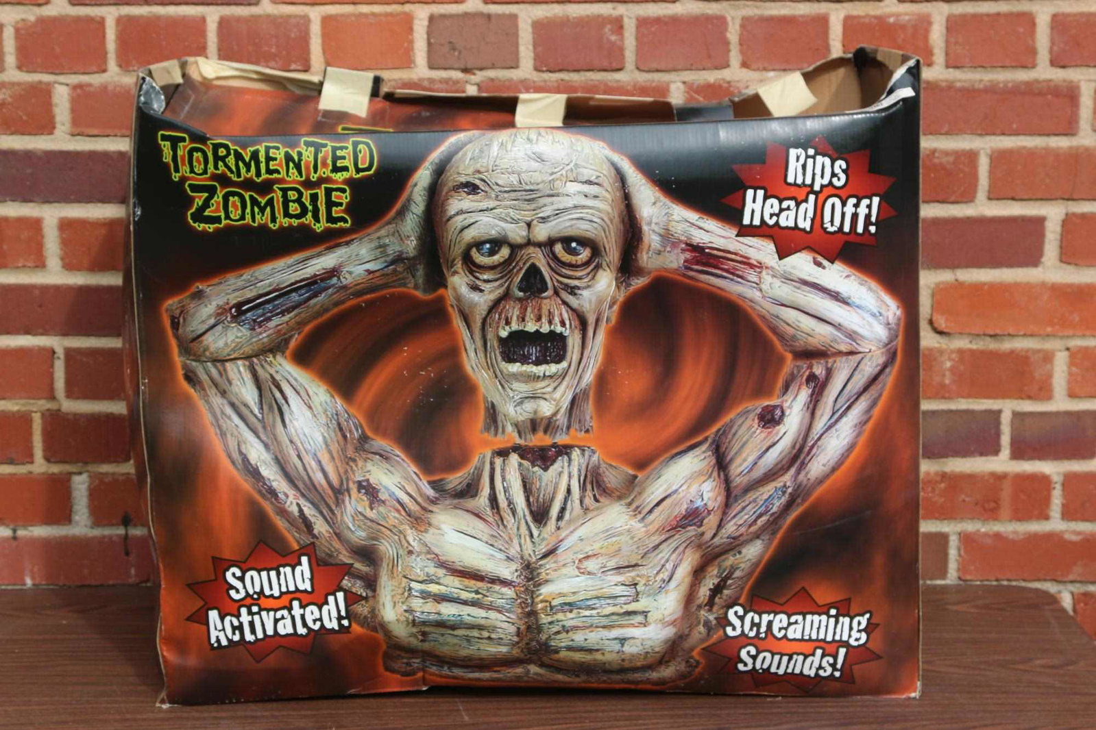 TORMENTED MECHANICAL ZOMBIE W/ SCREAMING SOUNDS: HALLOWEEN DECORATIVE TORMENTED ZOMBIE SOUND ACTIVATED WITH SCREAMING SOUNDS AND RIPS HEAD OFF! Condition GOOD