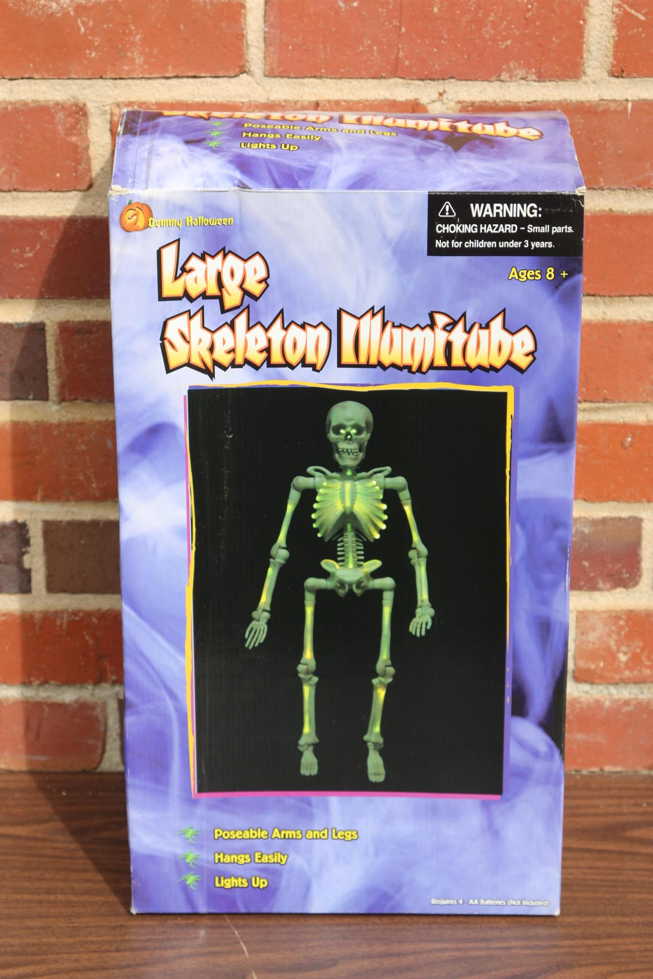 LARGE SKELETON ILLUMITUBE HALLOWEEN DECORATION: LARGE SKELETON HAS POSABLE ARMS AND LEGS, HANGS, ILLUMINATES Condition GOOD