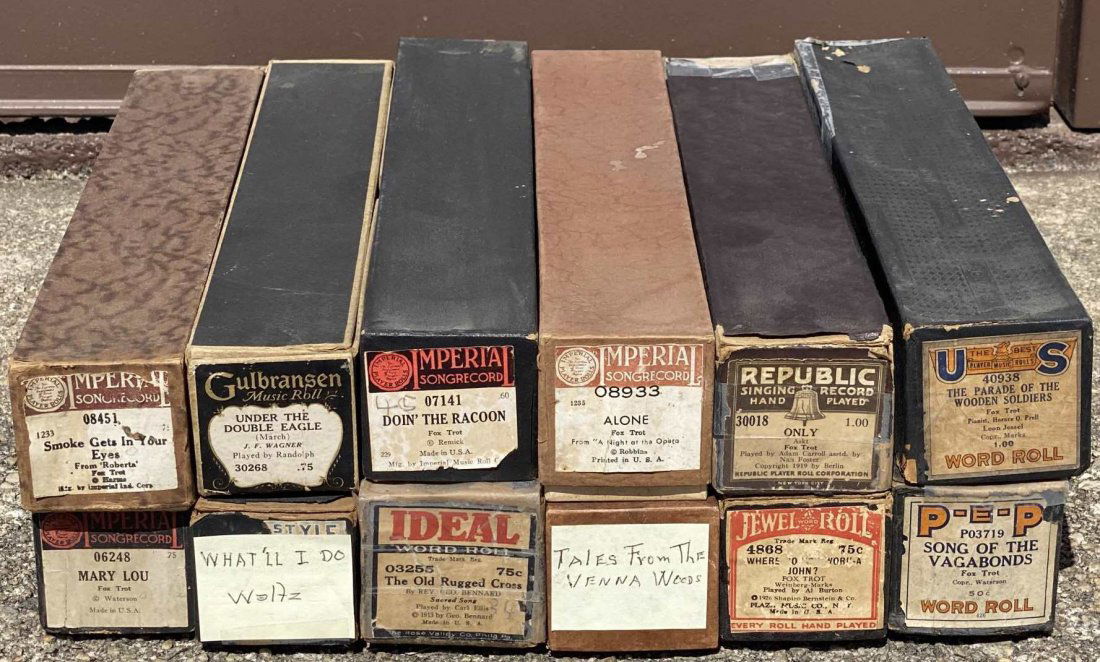 VINTAGE PLAYER PIANO MUSIC ROLLS GROUPING: VINTAGE PLAYER PIANO MUSIC ROLLS GROUPING OF 12 INCLUDING TITLES 08451 SMOKE GETS IN YOUR EYES, 30268 UNDER THE DOUBLE EAGLE 07141 DOIN' THE RACOON 08933 ALONE, 30018 ONLY, 40938 THE PARADE OF THE WOD