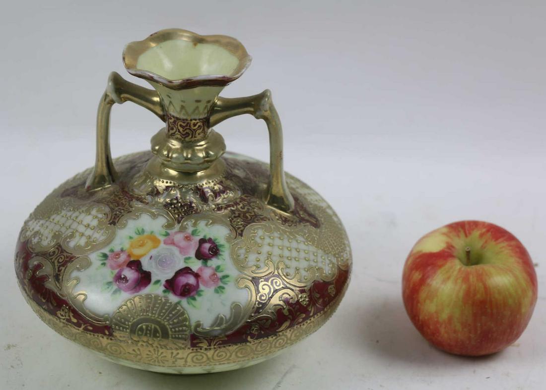 NIPPON HAND PAINTED TWIN HANDLE VASE: NIPPON HAND PAINTED TWIN HANDLE VASE Condition GOOD H 7 W 7 IN