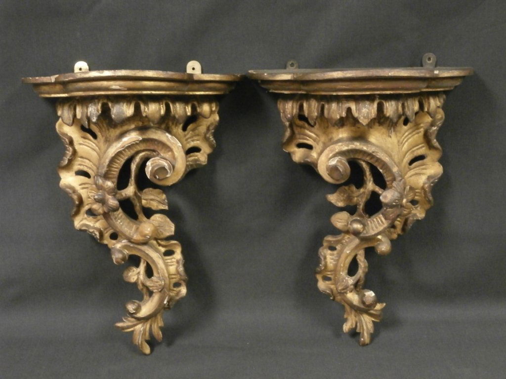 EARLY 19TH CENTURY PAIR OF CARVED GILT WALL BRACKETS:: Pair of early Italian carved Rococo foliate wall brackets. 17" X 6" X 12.5".