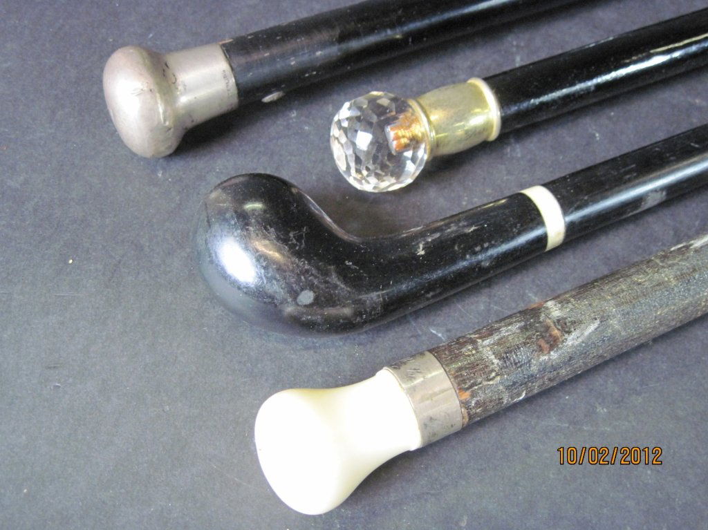 GROUP OF FOUR EBONY, STERLING, IVORY CANES:: Group of four ebony, sterling, ivory canes. 37", 36", 35", 34".
