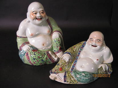 TWO CHINESE PORCELAIN BUDDHAS:: Two Chinese porcelain buddhas. Sitting 9 1/2".. laying down 5".