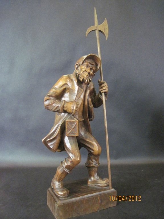 FINE CARVED BLACK FOREST FIGURE:: Carved black forest figure.