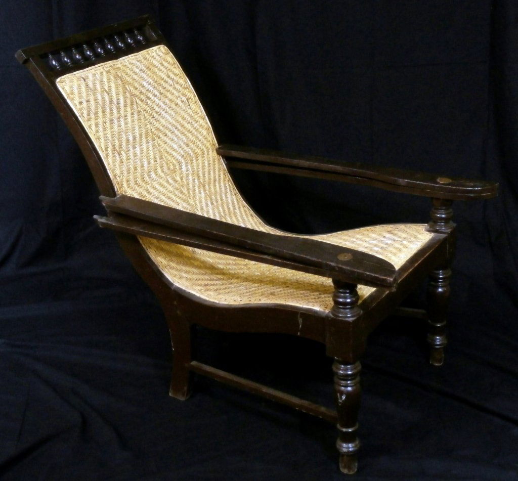 CARIBBEAN ANTIQUE WOVEN RATTAN PLANTATION CHAIR:: Caribbean antique woven rattan plantation chair.
