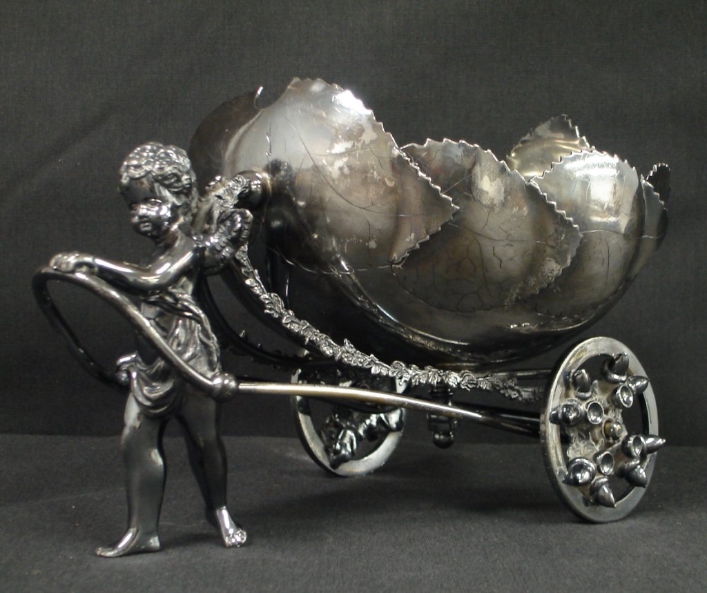 SILVER PLATE NUT BOWL WITH CHERUB AND CHARIOT:: Silver plate nut bowl with cherub and chariot.