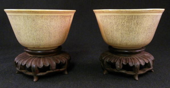 EARLY CHINESE IVORY POEM CUPS:: From the Estate of Bob Gibson originally purchased from the Firestone Estate in Pinehurst late 18th century with a story poem script and floral foliate design with original stands.