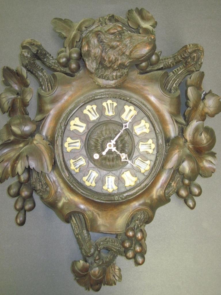 19TH C. SWISS HAND BLACK FOREST CARVED WALL CLOCK:: Antique Swiss carved black forest wall clock.