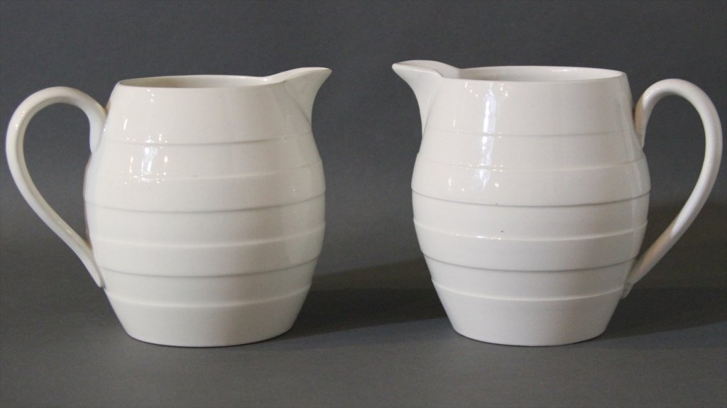 BOOTHS TWO ENGLISH WHITE CREAMWARE PITCHERS:: 5.75"H X 7.25"W.
