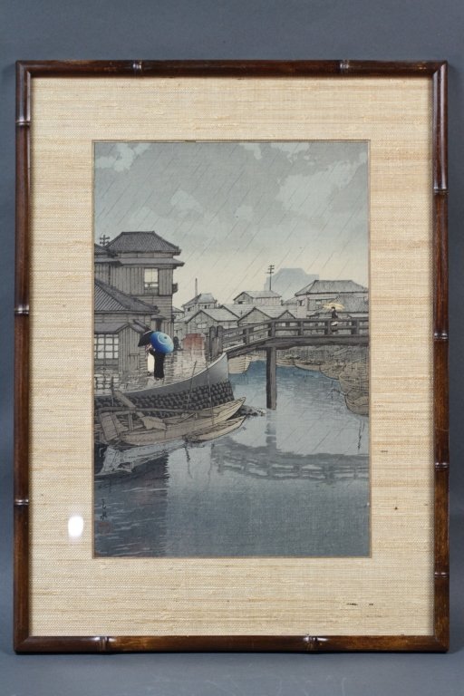 JAPANESE KAWASE HASUI (1883-1957) :: sight: 14" H X 9 1/4" W frame: 19 6/8"H X 14 1/2" W "Rainy Season at Ryoshimachi, Shinagawa" Kawase Hasui (1883-1957) Source: Carnegie Museum of Art website http://www.cmoa.org/exhibitions/archives04f
