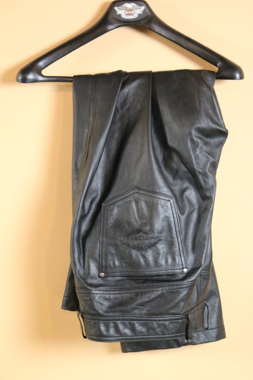 HARLEY DAVIDSON LEATHER AND MILITARY PANTS: PAIR OF LEATHER AND PAIR OF MILITARY HARLEY DAVIDSON PANTS (SIZE 44)