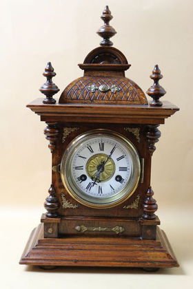 ANTIQUE GERMAN WALNUT CLOCK: ANTIQUE GERMAN WALNUT CLOCK FROM THE ERVING ESTATE