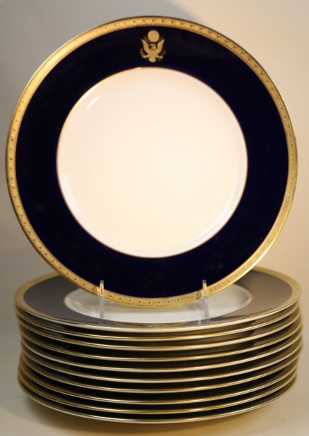 E. PLURIBUS UNUM COBALT OLD IVORY SYRACUSE CHINA: 10.5" DIAMETER, 11 PLATES; SYRACUSE CHINA O.P.C.O.; DECORATED WITH BALD EAGLE "E. PLURIBUS UNUM" IN GILT TRIM ON COBALT RIM