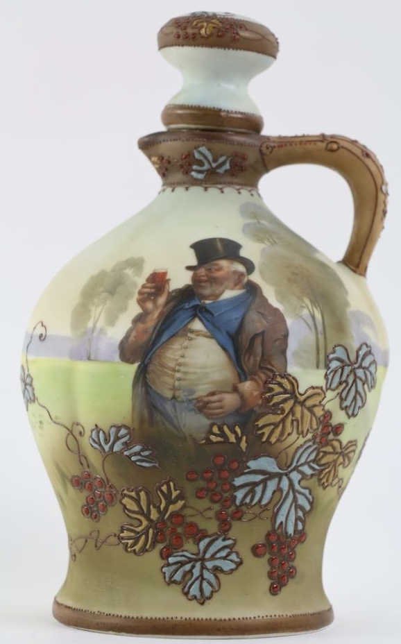 JAPANESE NIPPON RARE WINE JUG WITH PORTRAIT: Japanese Nippon Rare Wine Jug with Portrait and Enameling of Grapes and Leaves: Measures 9 1/2" high with M in Wreath mark. Good condition.