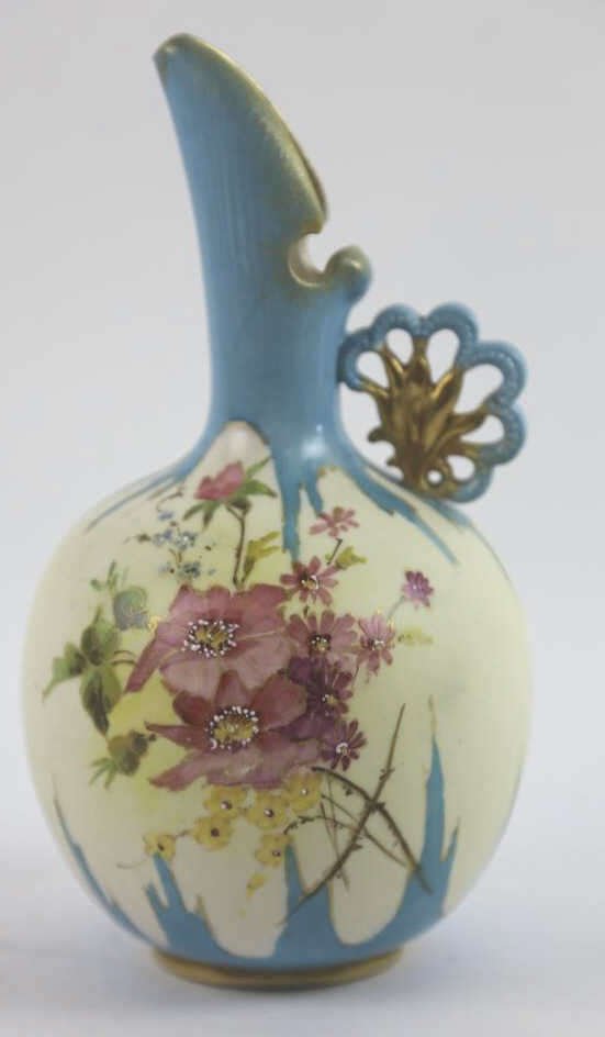 HAND PAINTED FLORALPITCHER WITH DAISY HANDLE: 9"' PITCHER HAS UNIQUE SHAPE WITH FLORAL HANDLE