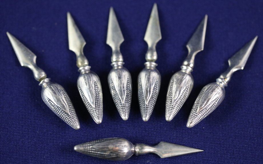 STERLING SILVER CORN HOLDERS: 7 STERLING SILVER CORN HOLDERS