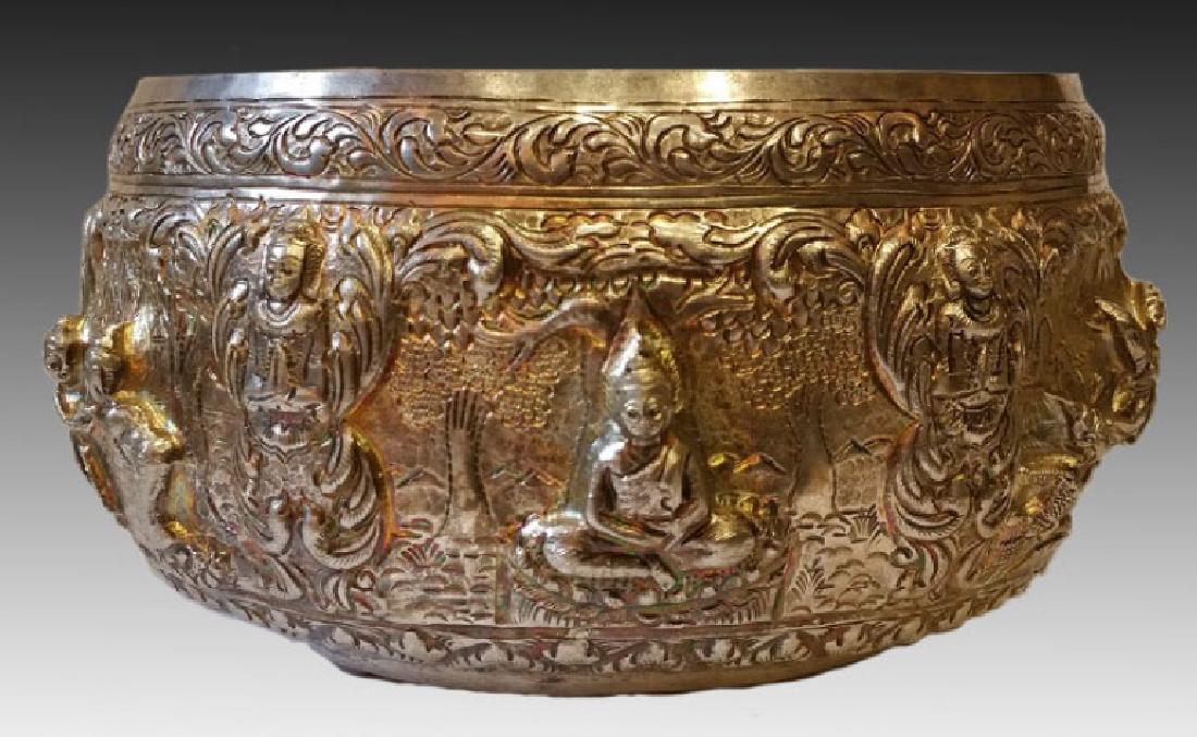 THAI ANTIQUE SILVER ALMS BOWL: Antique Thai silver alms bowl with high relief design depicting the life of the Buddha. Signed on bottom. 5" x 9"