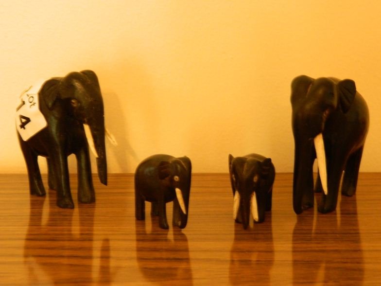 Four ebony and ivory elephants (India) c. 1920: Four ebony and ivory elephants (India) c. 1920