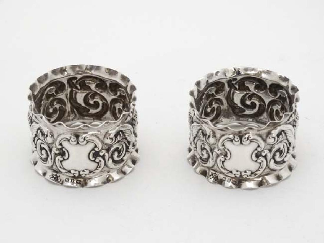 A pair of Victorian silver napkin rings with embossed (1 of 4)