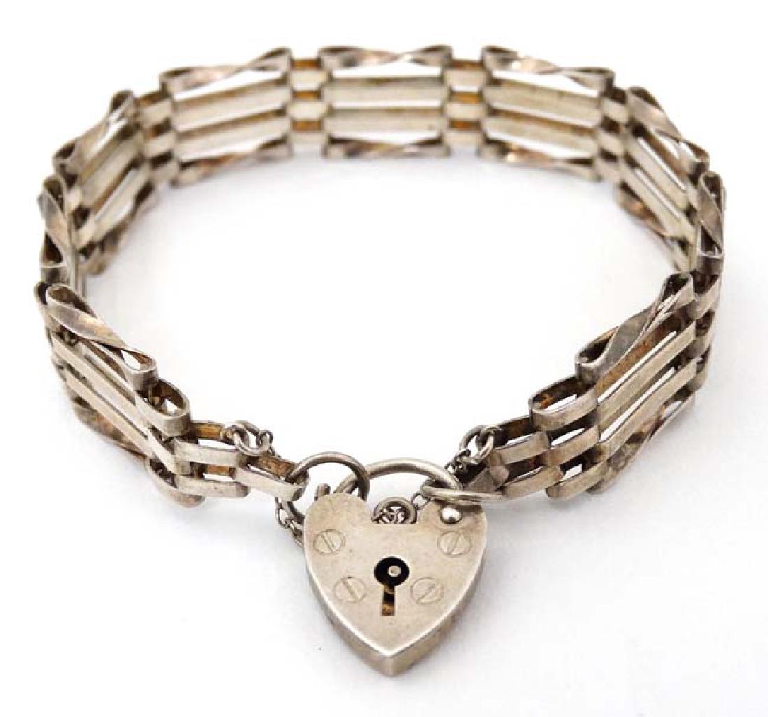A silver bracelet with padlock clasp hallmarked  London (1 of 4)