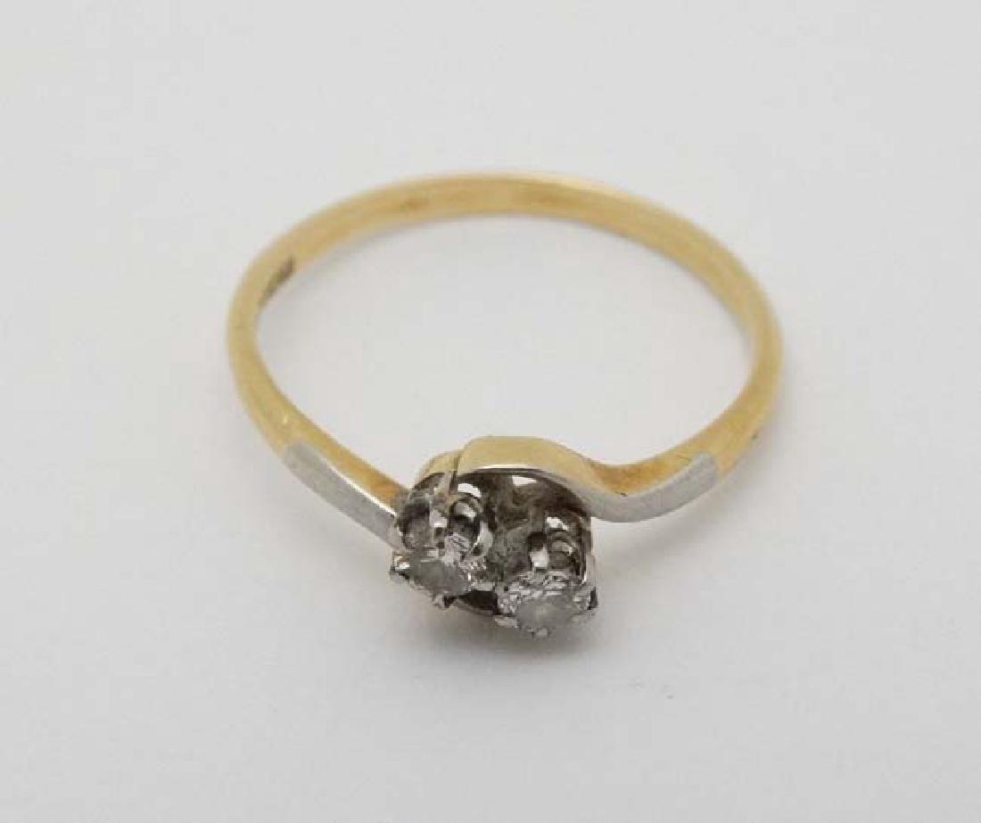 An 18ct ct gold ring set with two diamonds to top (1 of 4)