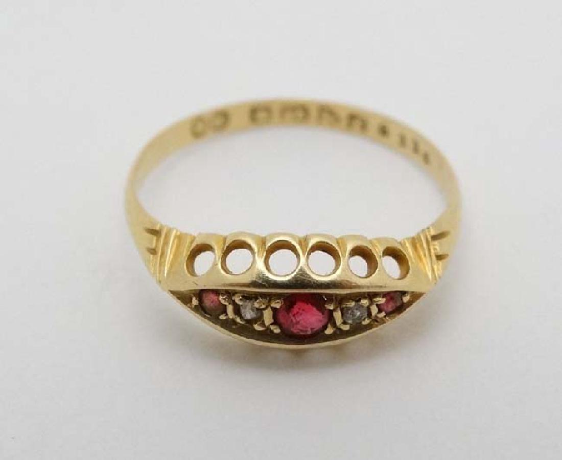 An 18ct gold ring set with diamonds and red stones. (1 of 4)