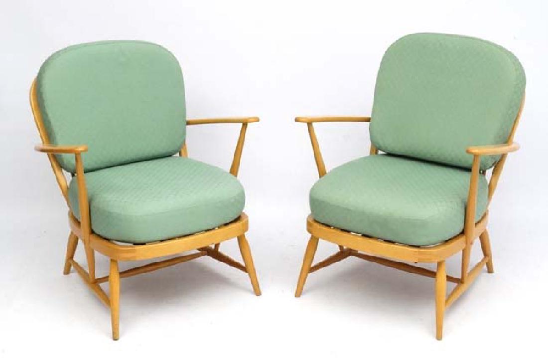 Vintage Retro : A pair of British blonde wood Windsor: Vintage Retro : A pair of British blonde wood Windsor Armchaîrs with Ercol blue sticker verso.