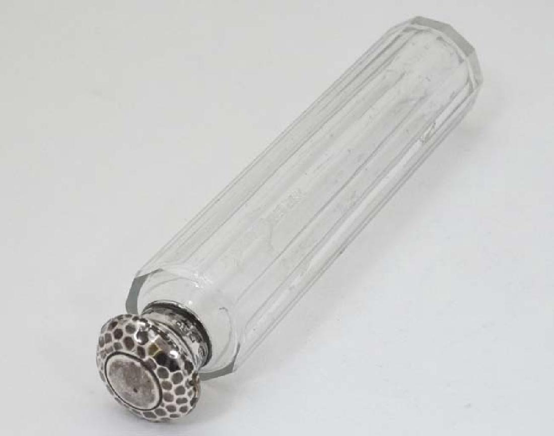 A glass dressing table bottle with silver top (1 of 5)