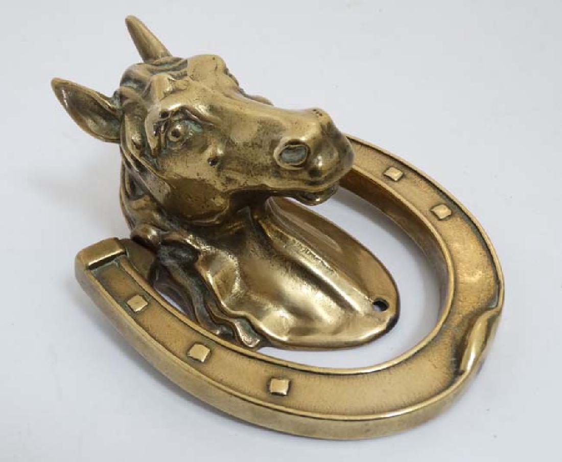 A cast brass door knocker in the form of a horses head (1 of 4)