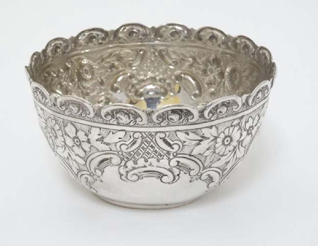 A silver bowl with embossed floral and C-scroll (1 of 5)